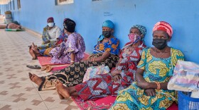 People in protective masks wait in the corridor of a hospital in Bunia, Congo, Tuesday, May 19, 2026.