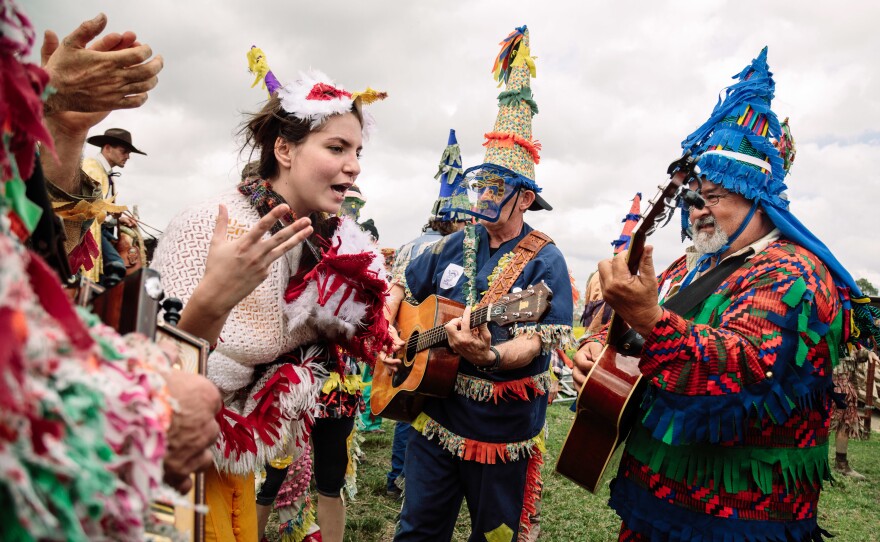Once the courir is over bands play music while revelers eat gumbo and rest after a lot of walking and running.