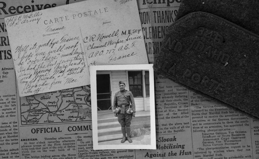 Various contents in the trunk such as a newspaper, a handwritten letter and a U.S. army cap illustrate his experiences in France while he was serving in WWI. The photograph of John B. McGillis was reportedly taken after the war, in an unknown location. While in uniform, he shows off his artifacts collected from war.
