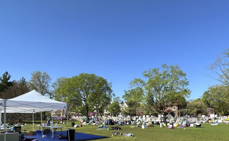 Tents, flags and other supplies remain at Deering Meadow on Northwestern University's campus in Evanston, Ill., on April 30, a day after the university and protest organizers reached an agreement.