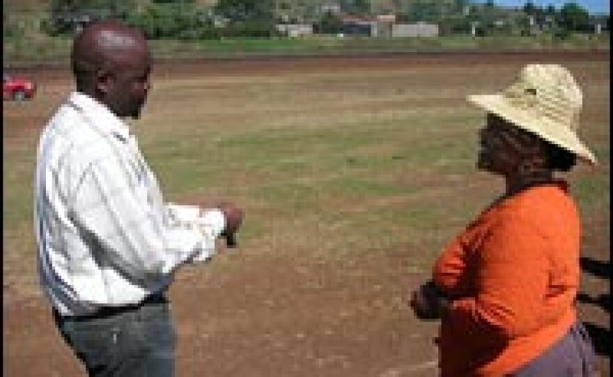 Ernest Phelane, principal at Holy Trinity High School in Moyeni, discusses the AIDS crisis at his school with Mapitso Panyane. She is commissioner of Lesotho's Quitung District, which has few resources to confront the AIDS pandemic.