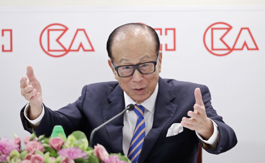 Li Ka-shing speaks at a news conference in Hong Kong last year. The nonagenarian tycoon purchased full-page ads in local newspapers warning against violence — but at least one scholar of Chinese language sees a secret message of support for the protesters.