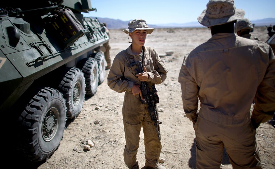 Lance Cpl. Brittany Dunklee talks with her fellow marines.