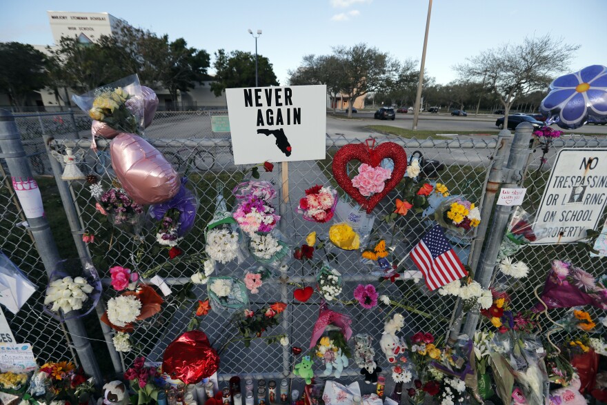 A makeshift memorial is seen outside the Marjory Stoneman Douglas High School, where 17 students and faculty were killed in a mass shooting on Wednesday, in Parkland, Fla., Monday, Feb. 19, 2018.