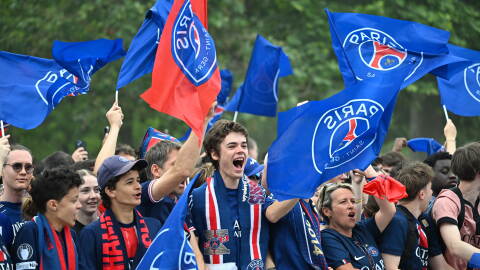 PSG fans celebrate the day after winning the Champions League title, at the Eiffel Tower, in Paris, Sunday, May 31, 2026.