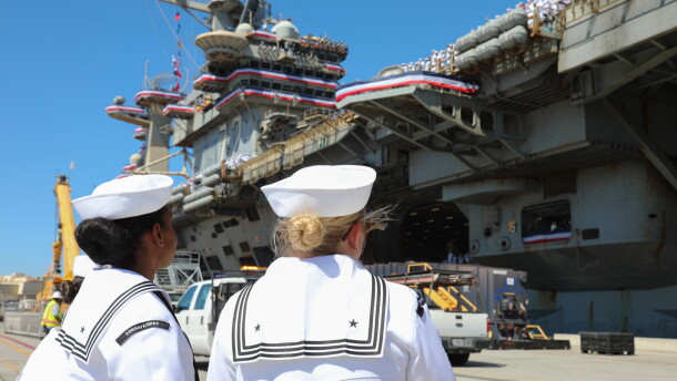 Two Sailors welcome USS Lincoln's landing on Oct. 8, 2026.