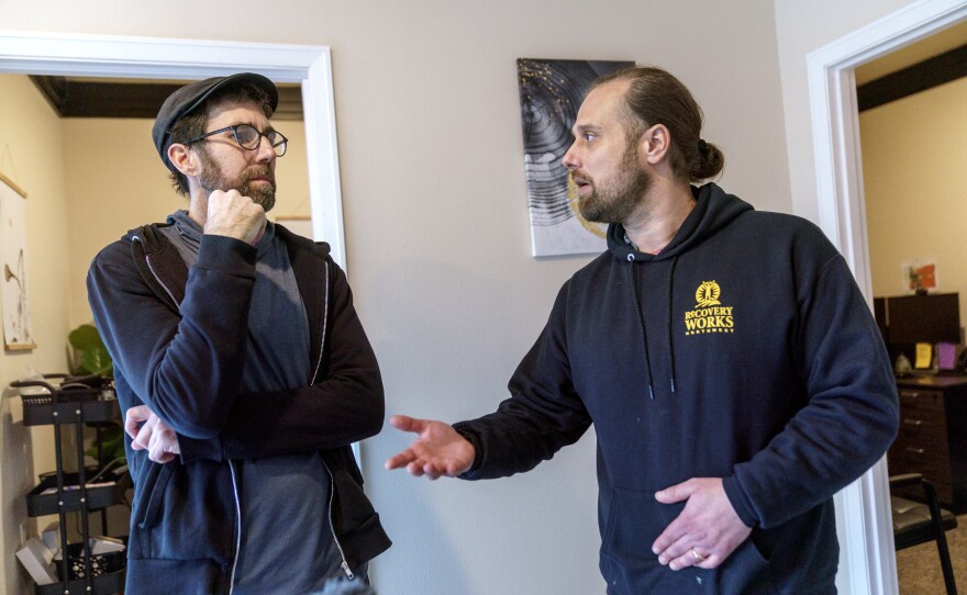 Recovery Works Northwest counselor Damian Thomas, left, talks with Joe Bazeghi, director of engagement for the organization, in the Portland, Ore. area.