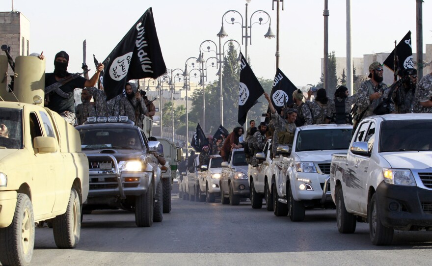 Islamic State fighters travel through the streets of Syria's northern Raqqa province on June 30. The group made territorial gains this year, but is now under attack from both the U.S. and Syrian militaries.
