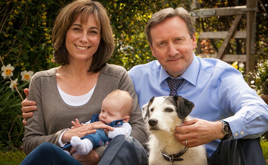 Sarah (Fiona Dolman on left), DCI John Barnaby's (Neil Dudgeon on right) wife of more than 10 years, is the headmistress of the Causton Comprehensive School in Midsomer county and lives with John and their dog Sykes in a large country cottage. This season, Sarah and John welcome their new daughter, Betty, (center) to the world!