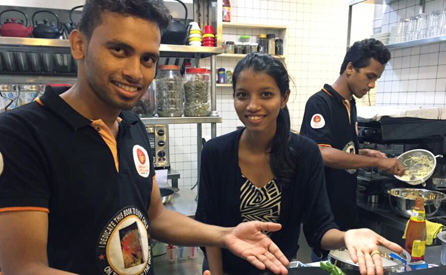 Anil Kurup, the cafe's baker, grew up in the same orphanage as the owner, Amin Sheikh.