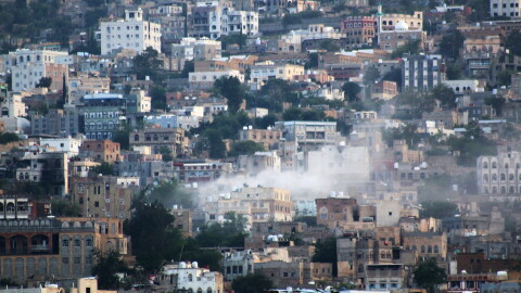 FILE - Smoke rises after an attack by Houthi rebels on the city of Taiz, Yemen, on Oct. 21, 2015. (AP Photo/Abdulnasser Alseddik, File)