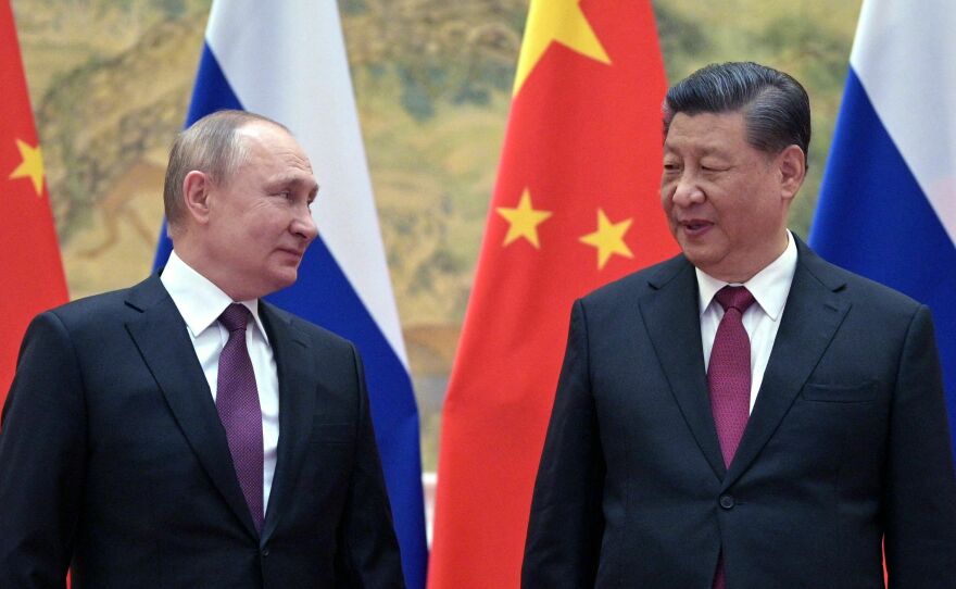 Russian President Vladimir Putin and Chinese President Xi Jinping pose for a photograph during their meeting in Beijing, on Feb. 4, 2022.