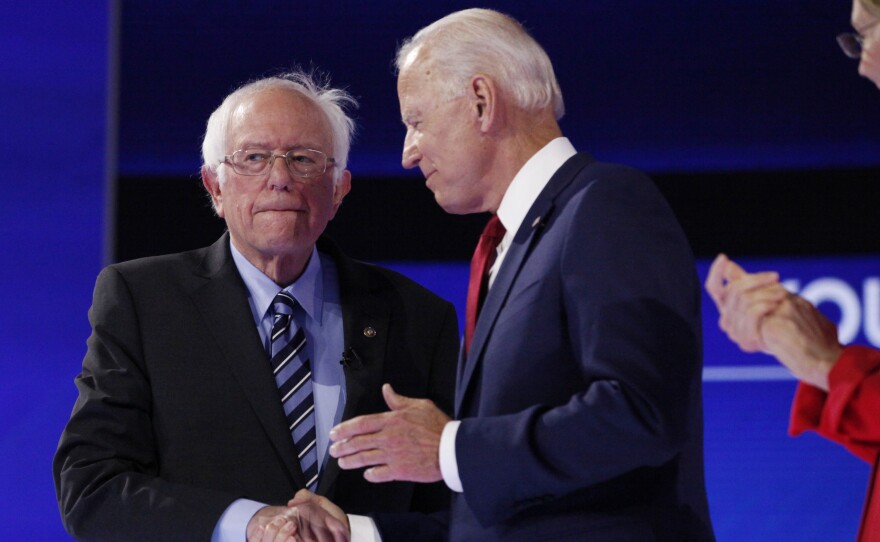 Sen. Bernie Sanders shakes hands with former Vice President Joe Biden Thursday.