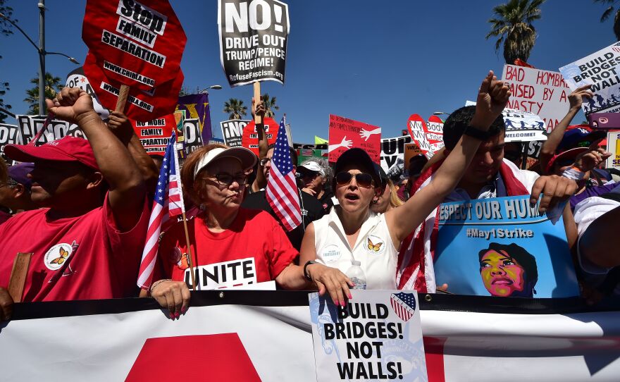 Protesters march against President Trump's immigration policy in Los Angeles on Monday, where tens of thousands are expected to take to the streets on May Day.