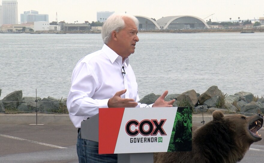 Above: North County businessman and gubernatorial candidate John Cox appearing with Tag the bear at a campaign stop in Shelter Island, May 11, 2021.