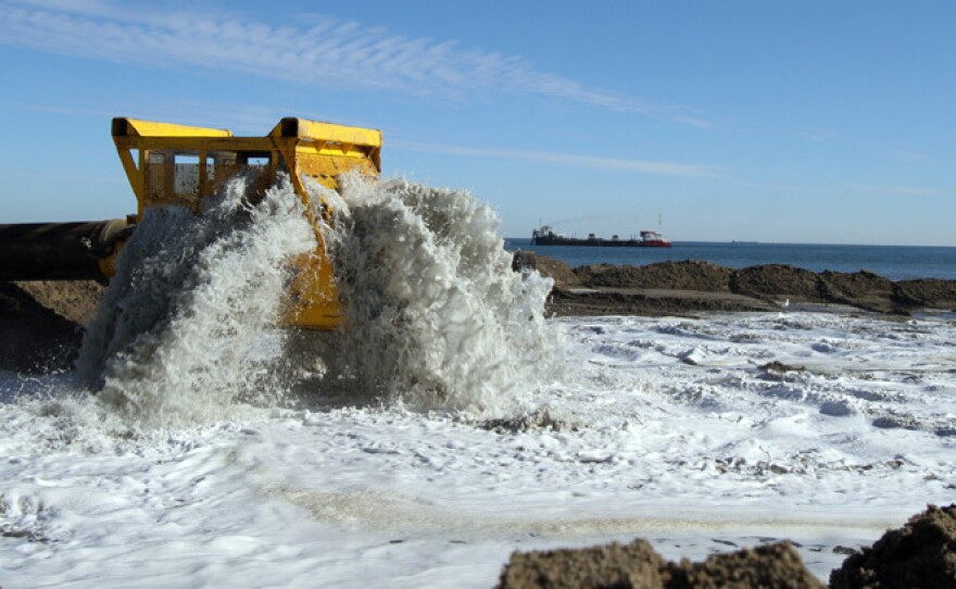 Workers reconstruct a section of Virginia Beach. The federal government finances 65 percent of beach renourishment projects, local governments pay for the rest.