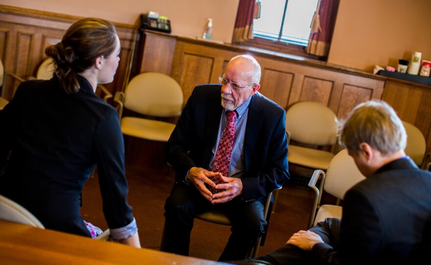 "The Legislature is more polarized than I've ever seen it," Risser says. "There are more straight party-line votes than there have ever been." Here, he meets with constituents about upcoming bills.