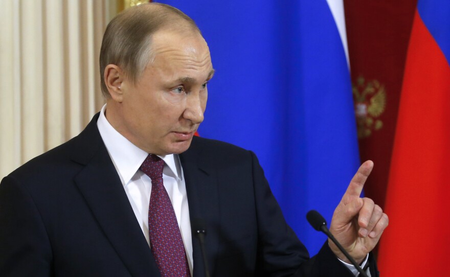 Russian President Vladimir Putin, shown during a joint news conference with his Moldovan counterpart following their meeting Tuesday in Moscow, said President-elect Donald Trump won a "convincing victory."