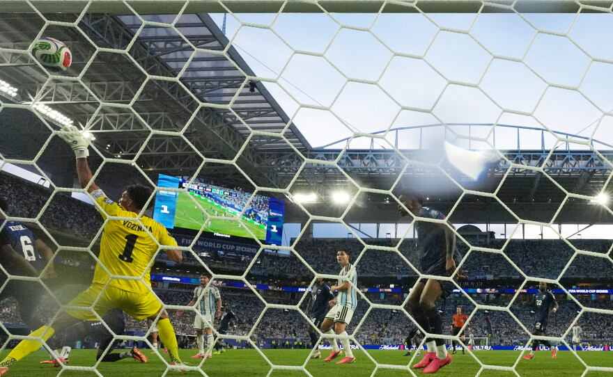 Cape Verde goalkeeper Vozinha (1) is scored on by Argentina's Lisandro Martinez during the World Cup round of 32 soccer match between Argentina and Cape Verde in Miami Gardens, Fla., Friday, July 3, 2026.