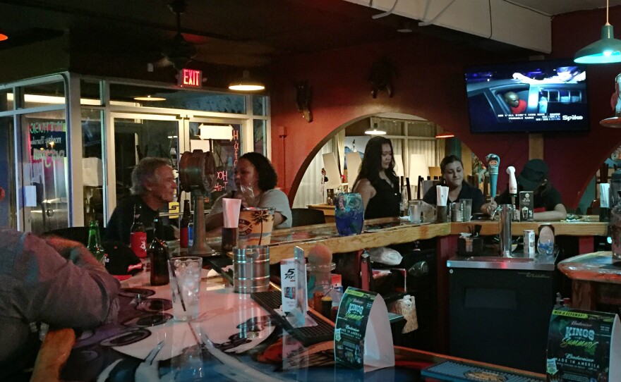 At Mosa's Joint in Guam, island residents and military personnel fill up the bar for Thursday happy hour.
