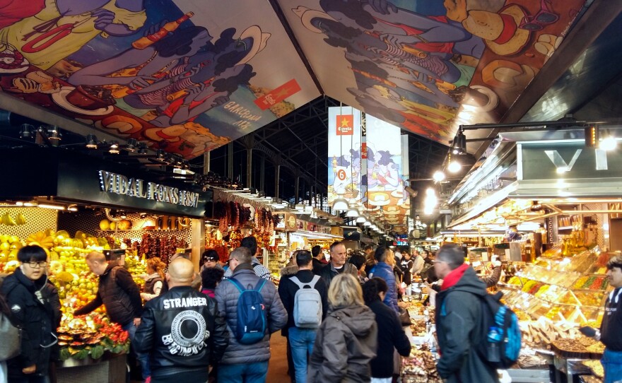 After vendors complained of over-crowding, Barcelona's City Hall now limits the number of tour groups allowed to enter the centuries-old La Boquería market.