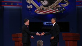 Democratic presidential candidate, U.S. President Barack Obama (R) shakes hands with Republican presidential candidate, former Massachusetts Gov. Mitt Romney (L) during the Presidential Debate at the University of Denver on October 3, 2012 in Denver, Colorado.