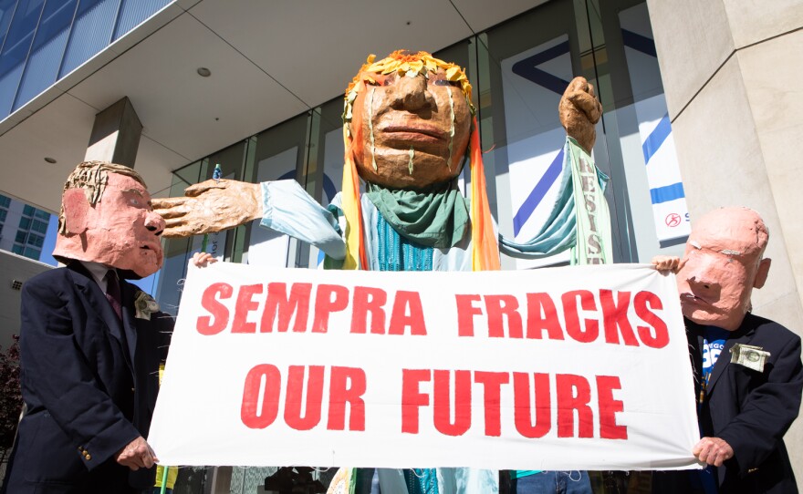 Protesters gather outside of Sempra Energy in downtown San Diego during the company's annual shareholder meeting. May 13, 2022.