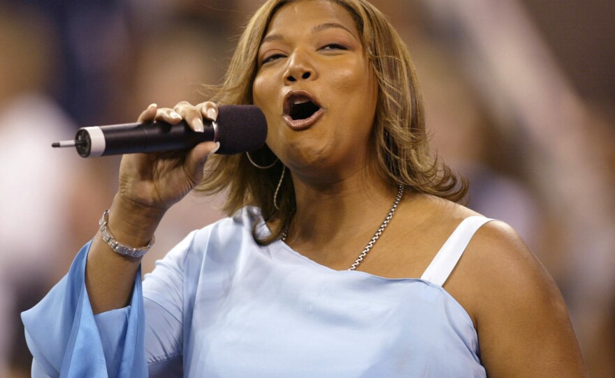 Queen Latifah sings the National Anthem at the opening ceremony of the 2002 US Open at the USTA National Tennis Center in Flushing Meadows Corona Park in Flushing, New York.