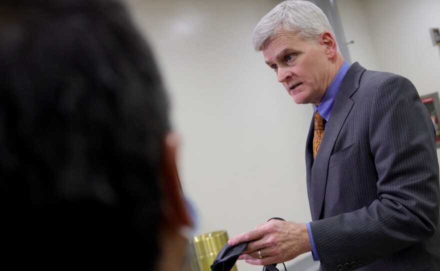 Sen. Bill Cassidy, R-La., talks with reporters while departing the U.S. Capitol after the third day of the impeachment trial.