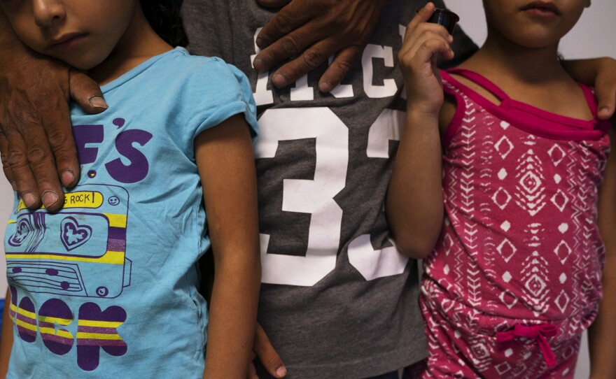 Giovani, with his son Jonathan (center), and twin daughters Catherine and Carla at a shelter in Ciudad Juárez. Giovani says that care has been hard for the family to get in Juárez.