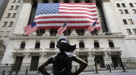 The Fearless Girl statue stands in front of the New York Stock Exchange, Monday, March 16, 2020 in New York. 