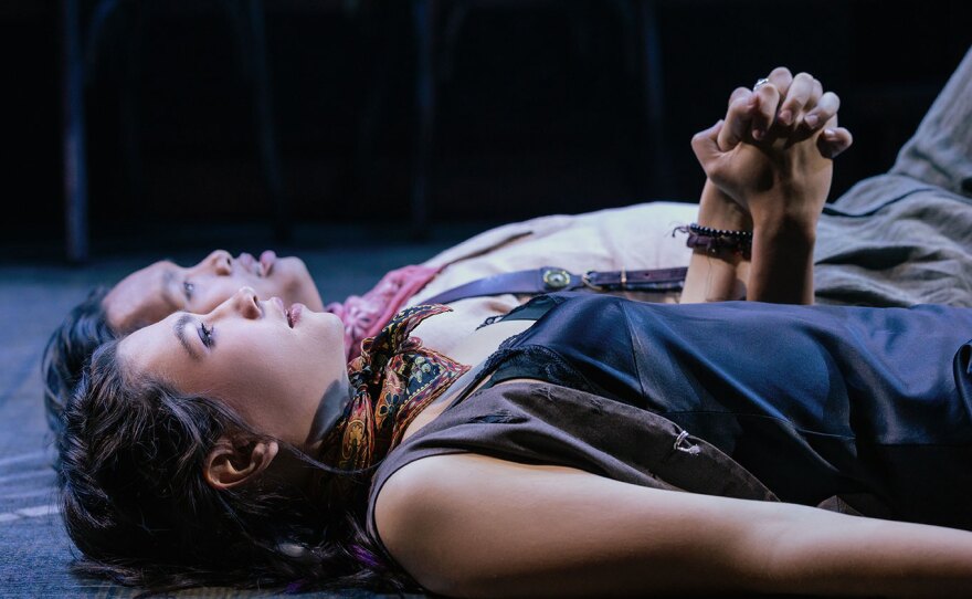 Megan Colton (Eurydice) and Bryan Munar (Orpheus) from the "Hadestown" North American tour are shown on stage in an undated production photo.