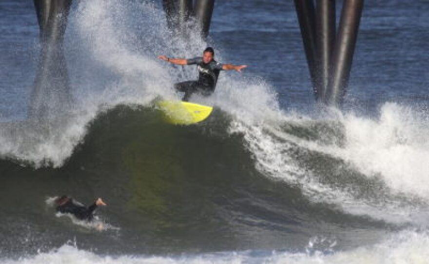 Serge Dedina surfing south of the Imperial Beach Pier in 2011.