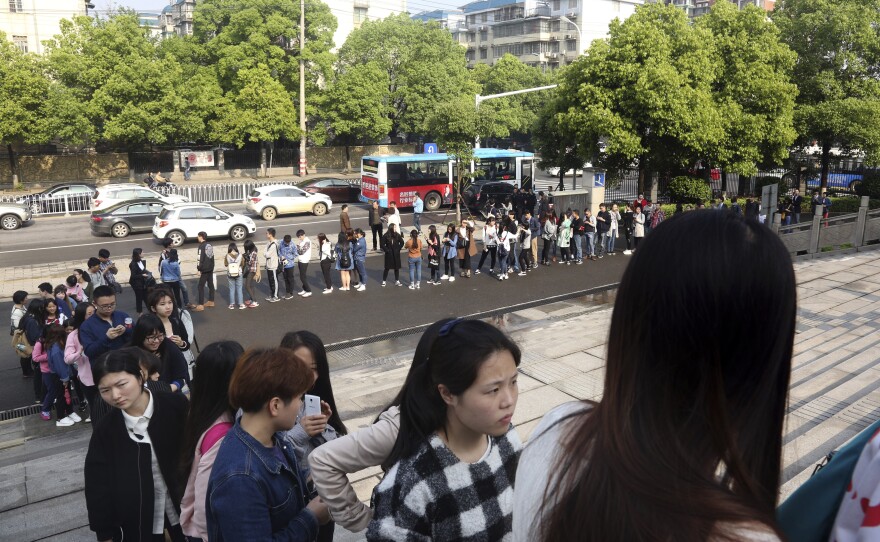 Supporters line up to attend the court session.