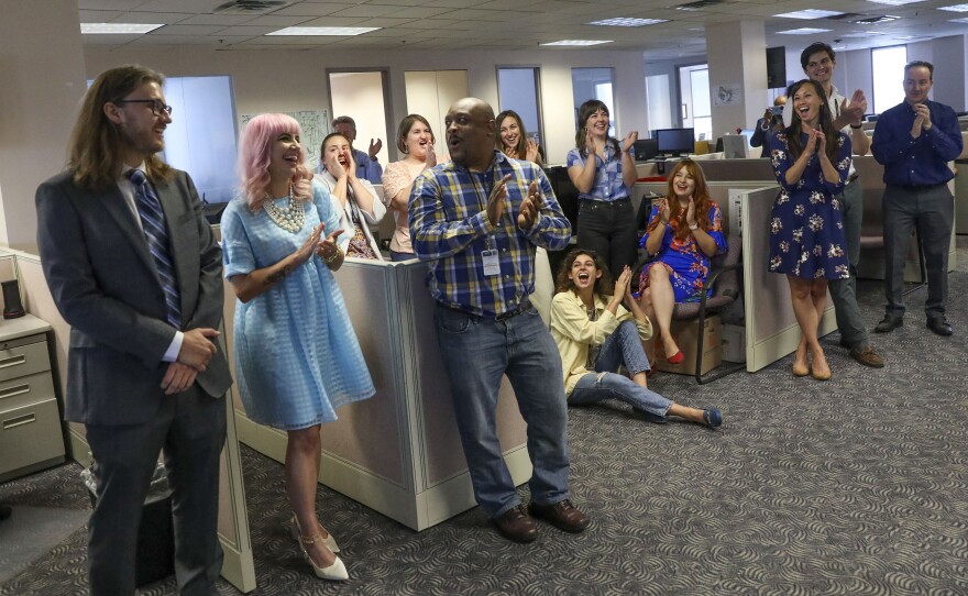 Tampa Bay Times reporters Corey G. Johnson, right, Rebecca Woolington, center, and Eli Murray, left, are announced as the winners of the Pulitzer Prize for investigative reporting on Monday. The winning series, "Poisoned," exposed dangers at Florida's only lead smelter.