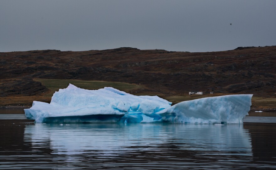 A piece of ice called a growler floats in a fjord near Narsarsuaq in southern Greenland. Growlers, like icebergs, are chunks of ice that have broken off glaciers or ice sheets.