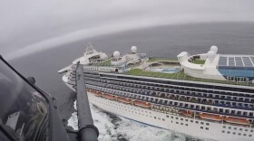 In this image from video, provided by the California National Guard, a helicopter carrying airmen with the 129th Rescue Wing flies over the Grand Princess cruise ship off the coast of California Thursday, March 5, 2020. 