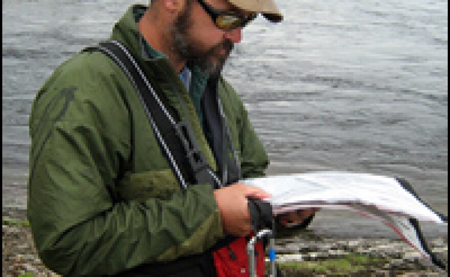 Phil Royce, an outdoor guide and geologist from St. Lawrence University, charts the next set of rapids on the Rupert River.