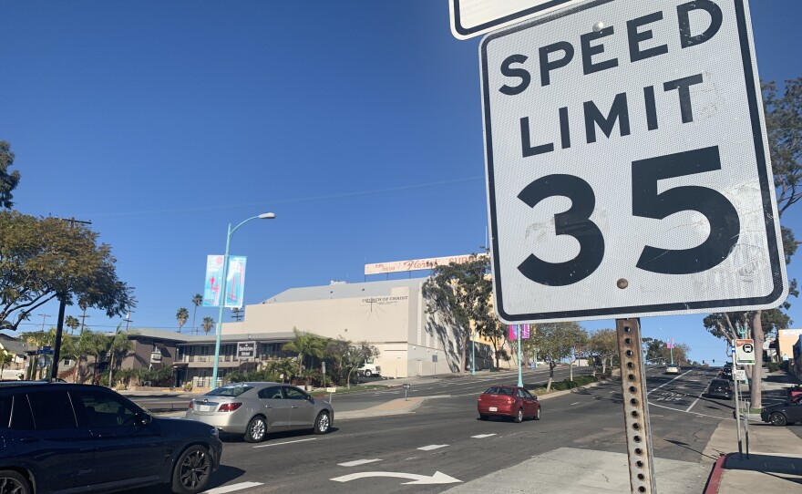 Cars drive past a 35 mph speed limit sign on El Cajon Boulevard, March 8, 2022.