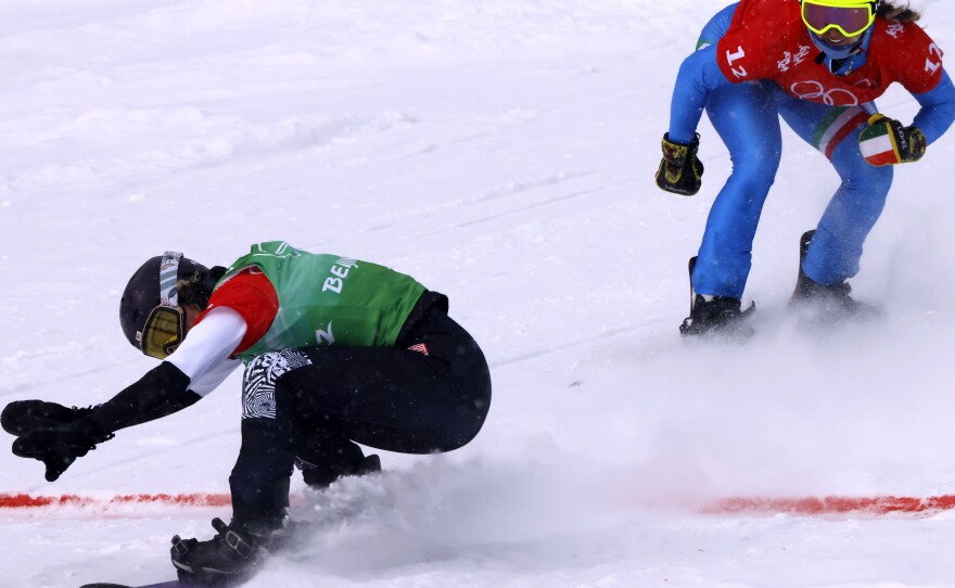 U.S. snowboarder Lindsey Jacobellis competes against Italy's Michela Moioli during the 2022 Beijing Olympic Games.