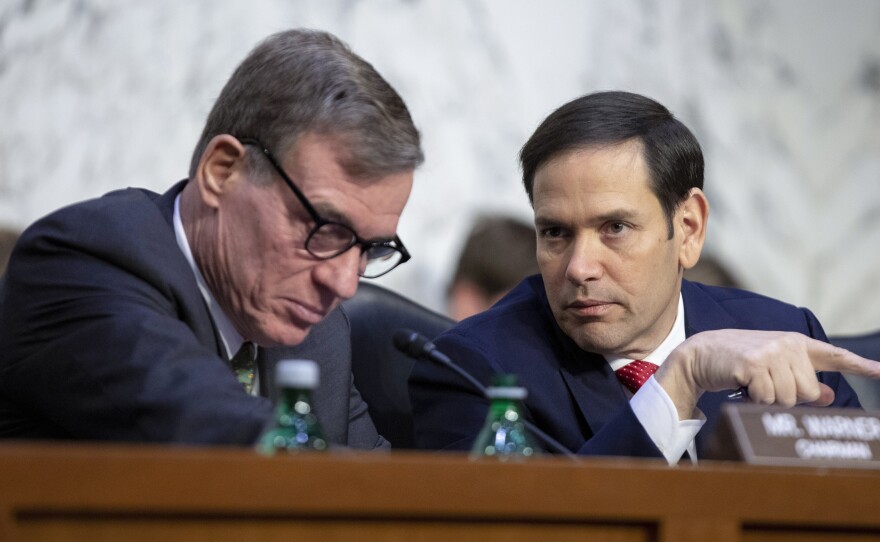 Senate Intelligence Committee Vice Chairman Marco Rubio, R-Fla., right, talks with Chairman Mark Warner, D-Va., left, during a panel hearing earlier this month.