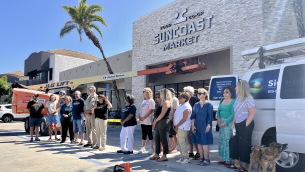 Community members and co-owners gather outside of SunCoast Market Co-op in Imperial Beach, July 31, 2025.