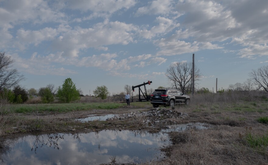 Scott Rabinowitz, president of Grand Resources, stands near a pump jack in Sperry, Okla., on March 20, 2024.