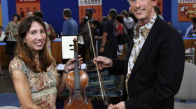 In the third and final hour of "Antiques Roadshow" from Honolulu, Hawaii, appraiser David Bonsey of Skinner plucks the owner of this antique violin out of the crowd. The violin and bow were passed down to the owner by her great-aunt - a professional violinist who purchased the instrument in 1921. According to accompanying documentation, the violin is a rare Camilli, made in 1737 in Mantua, Italy. Upon further inspection, however, Bonsey reveals that it's a fine forgery. Despite this sour note, the violin and bow as a pair could still make beautiful music together with an auction estimate of at $12,000 - $16,000.