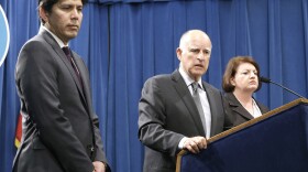 Gov. Jerry Brown answers a question about the budget agreement reached with legislative leaders at a Sacramento news conference, June 16, 2015. He is accompanied by Senate President Pro Tem Kevin de Leon, D-Los Angeles, and Assembly Speaker Toni Atkins, D-San Diego.