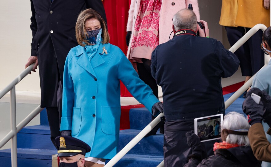 House Speaker Nancy Pelosi's brilliant blue coat appeared to have weathered a few snow flurries ahead of the inauguration ceremony.