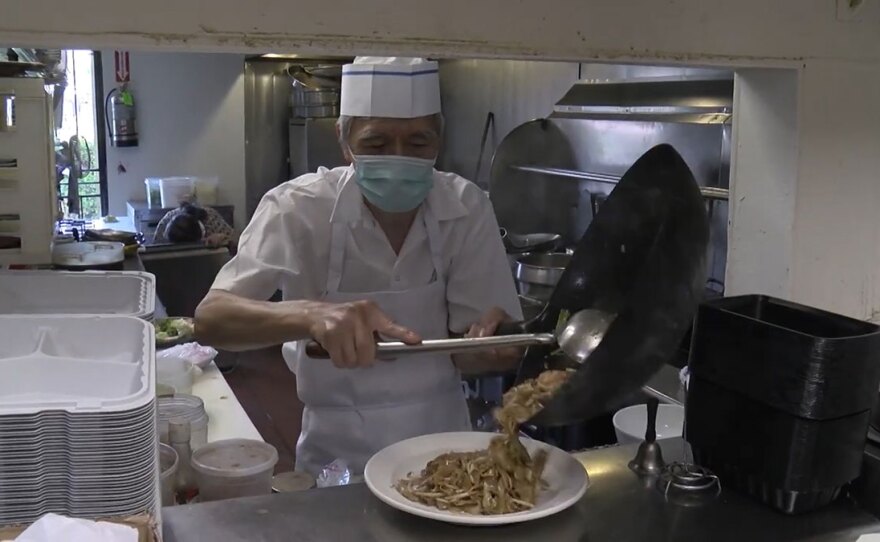 The chef of Hunan Chinese Restaurant working in the restaruant's kitchen in Rancho Bernardo. Sept. 2, 2020.