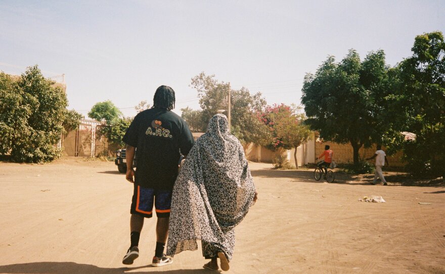 Sudanese American rapper Bas and a relative in Khartoum.