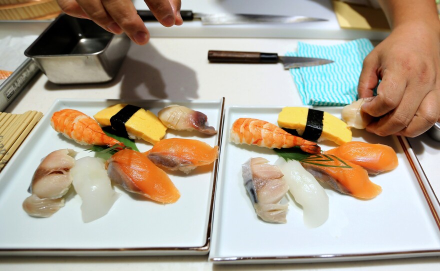 A sushi chef prepares a dish during the Global Sushi Challenge competition in Tokyo, Japan, last September. Japan's new program will certify Japanese restaurants outside of the country that meet the standards of traditional Japanese food, known as washoku.