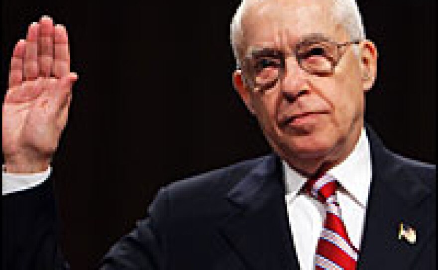 Retired federal Judge Michael B. Mukasey is sworn-in before the Senate Judiciary Committee on his nomination to be attorney general on Oct. 17. His nomination has stalled because he refused to say if waterboarding is illegal torture.